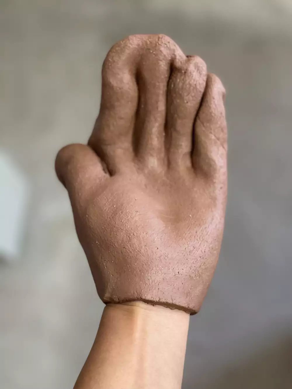 Clay moulded around a hand